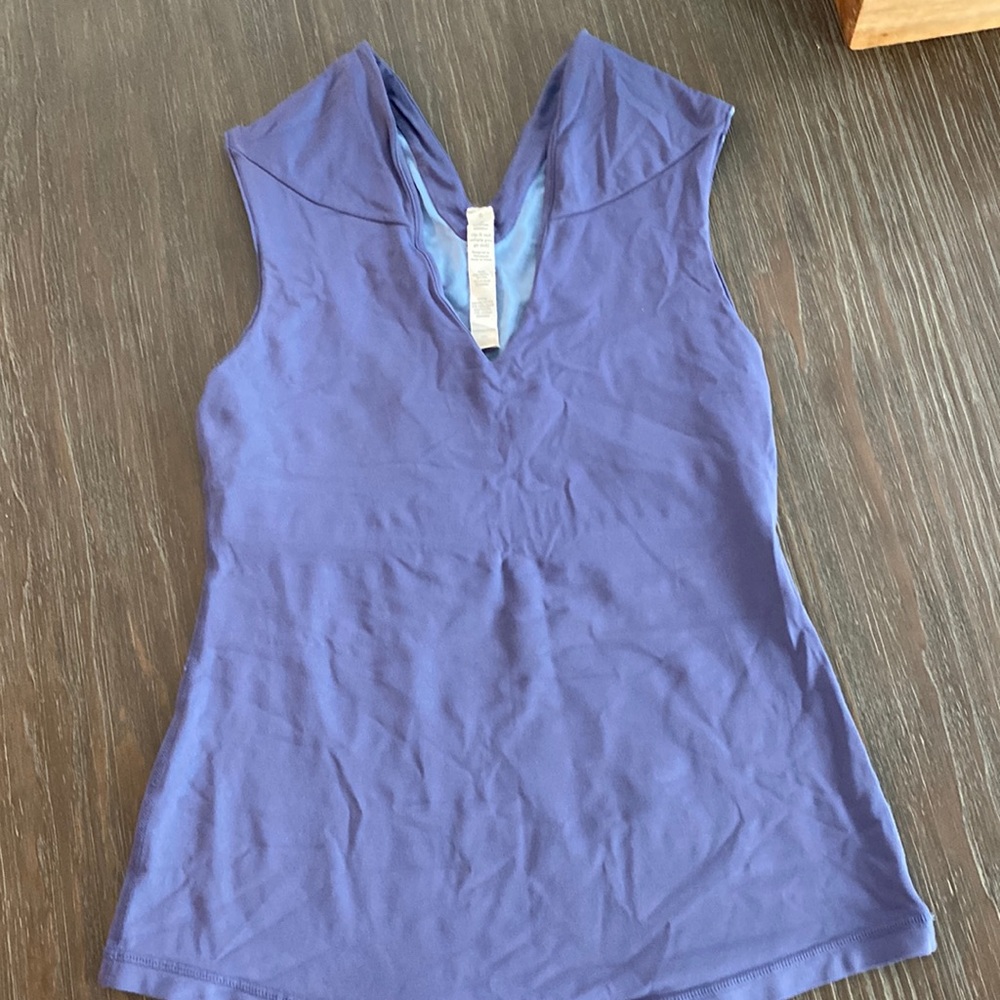 Lululemon workout shirt in size 6 with built-in bra.